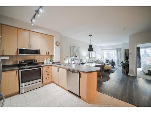 107-80 Port Street E, Mississauga, ON - Indoor Photo Showing Kitchen With Double Sink
