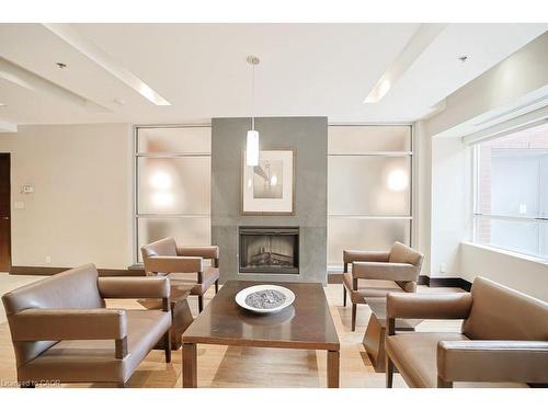 107-80 Port Street E, Mississauga, ON - Indoor Photo Showing Living Room With Fireplace