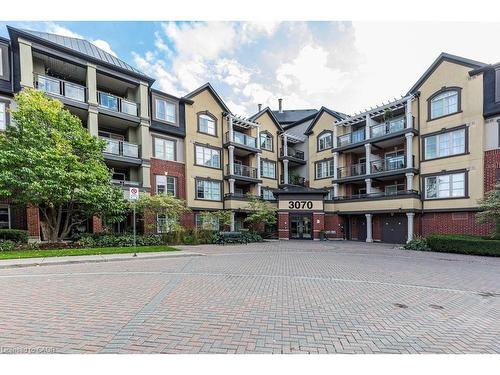401-3070 Rotary Way, Burlington, ON - Outdoor With Balcony With Facade