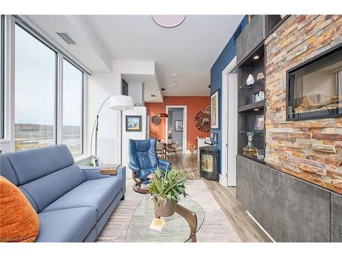 1807-385 Winston Road, Grimsby, ON - Indoor Photo Showing Living Room With Fireplace