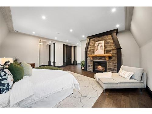23 Cameron Drive, Ancaster, ON - Indoor Photo Showing Bedroom With Fireplace