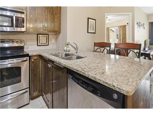 1402-330 Prince Charles Drive S, Welland, ON - Indoor Photo Showing Kitchen With Double Sink