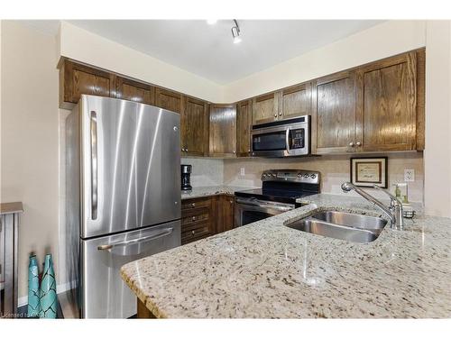 1402-330 Prince Charles Drive S, Welland, ON - Indoor Photo Showing Kitchen With Double Sink