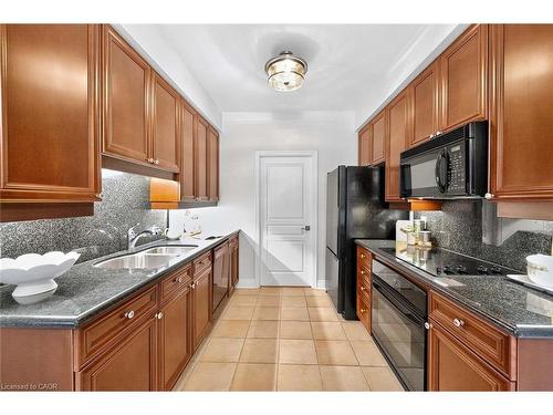 503-65 Port Street E, Mississauga, ON - Indoor Photo Showing Kitchen With Double Sink