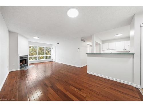 406-15 Hofstetter Avenue, Kitchener, ON - Indoor Photo Showing Living Room With Fireplace