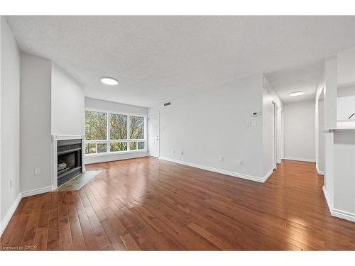 406-15 Hofstetter Avenue, Kitchener, ON - Indoor Photo Showing Living Room With Fireplace