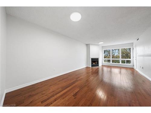 406-15 Hofstetter Avenue, Kitchener, ON - Indoor Photo Showing Living Room With Fireplace