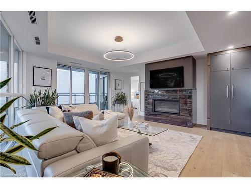 308-2060 Lakeshore Road, Burlington, ON - Indoor Photo Showing Living Room With Fireplace
