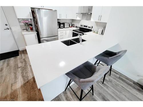 217-1 Redfern Avenue, Hamilton, ON - Indoor Photo Showing Kitchen With Stainless Steel Kitchen With Double Sink