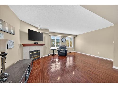 23-7 Southside Place, Hamilton, ON - Indoor Photo Showing Other Room With Fireplace
