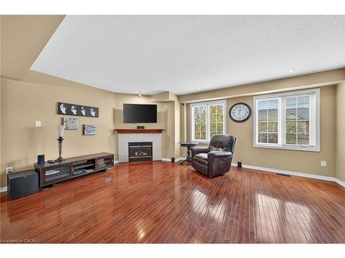 23-7 Southside Place, Hamilton, ON - Indoor Photo Showing Other Room With Fireplace