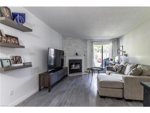 3-136 Conway Drive, London, ON - Indoor Photo Showing Living Room With Fireplace