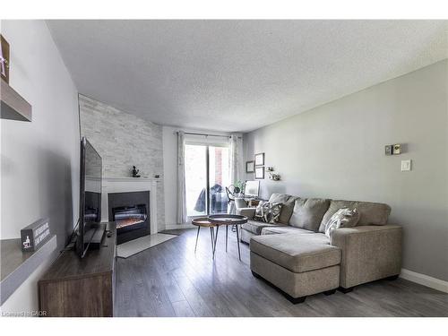 3-136 Conway Drive, London, ON - Indoor Photo Showing Living Room With Fireplace