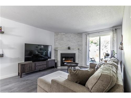 3-136 Conway Drive, London, ON - Indoor Photo Showing Living Room With Fireplace