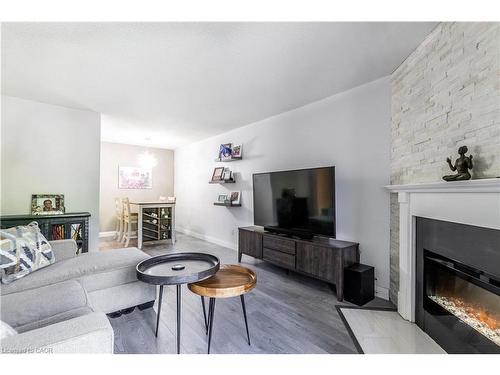 3-136 Conway Drive, London, ON - Indoor Photo Showing Living Room With Fireplace