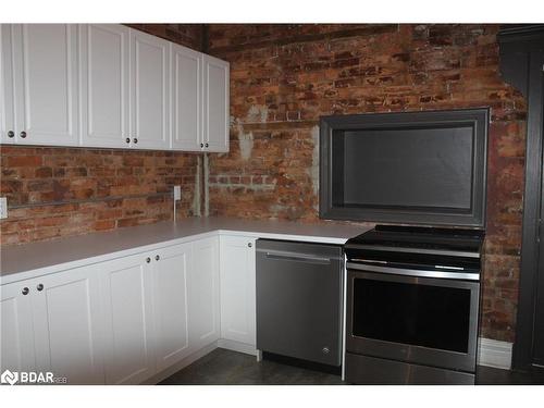 19 Oxford Street, Hamilton, ON - Indoor Photo Showing Kitchen With Fireplace