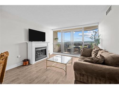 1107-5090 Pinedale Avenue, Burlington, ON - Indoor Photo Showing Living Room With Fireplace