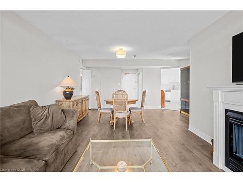 1107-5090 Pinedale Avenue, Burlington, ON - Indoor Photo Showing Living Room With Fireplace