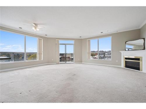 706-255 Keats Way, Waterloo, ON - Indoor Photo Showing Living Room With Fireplace