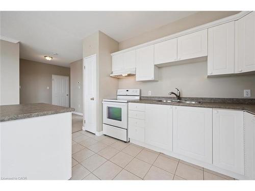 706-255 Keats Way, Waterloo, ON - Indoor Photo Showing Kitchen With Double Sink