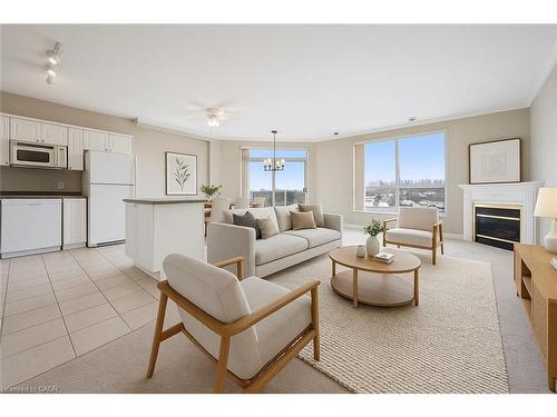 706-255 Keats Way, Waterloo, ON - Indoor Photo Showing Living Room With Fireplace
