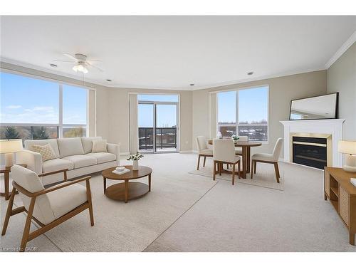 706-255 Keats Way, Waterloo, ON - Indoor Photo Showing Living Room With Fireplace