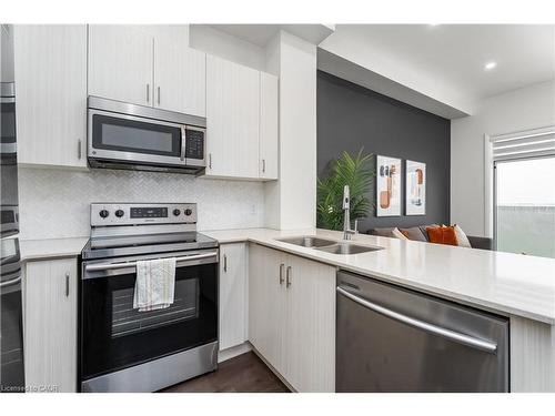 627-1105 Leger Way, Milton, ON - Indoor Photo Showing Kitchen With Double Sink
