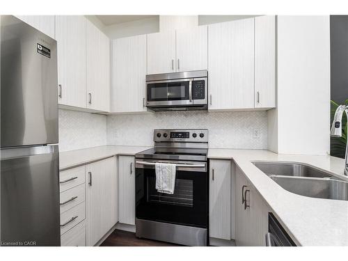 627-1105 Leger Way, Milton, ON - Indoor Photo Showing Kitchen With Double Sink
