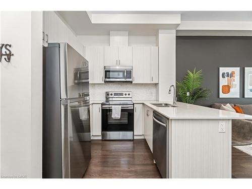 627-1105 Leger Way, Milton, ON - Indoor Photo Showing Kitchen With Double Sink