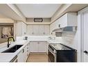 B403-216 Plains Road W, Burlington, ON  - Indoor Photo Showing Kitchen With Double Sink 