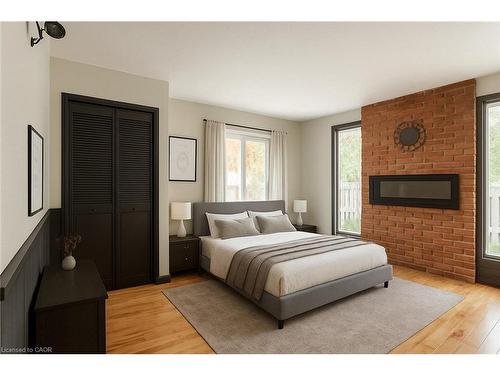 65 Banff Street, Caledonia, ON - Indoor Photo Showing Bedroom With Fireplace