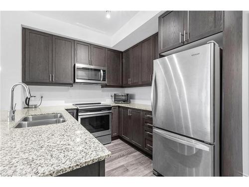 226-1050 Main Street E, Milton, ON - Indoor Photo Showing Kitchen With Double Sink