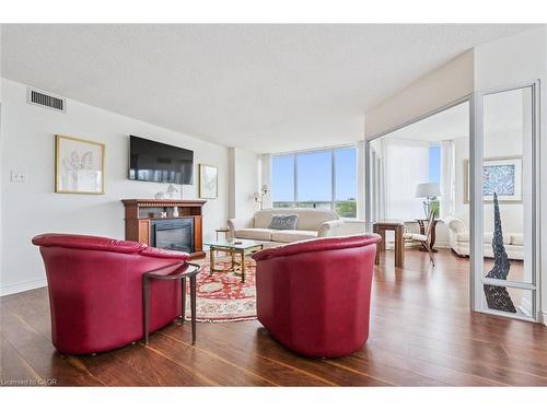 702-6 Willow Street, Waterloo, ON - Indoor Photo Showing Living Room With Fireplace