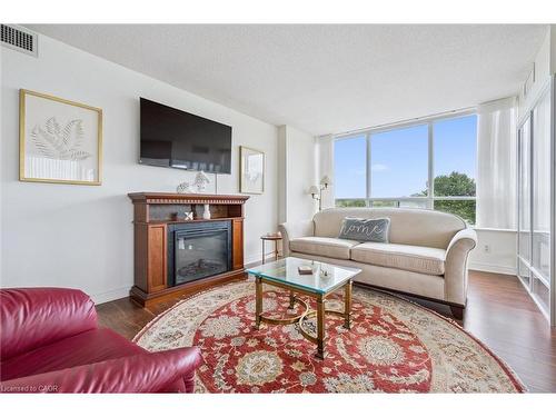 702-6 Willow Street, Waterloo, ON - Indoor Photo Showing Living Room With Fireplace