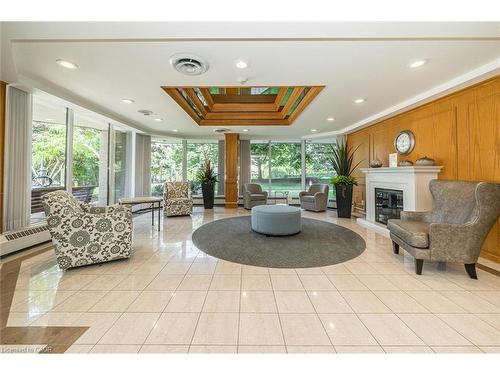 702-6 Willow Street, Waterloo, ON - Indoor Photo Showing Other Room With Fireplace