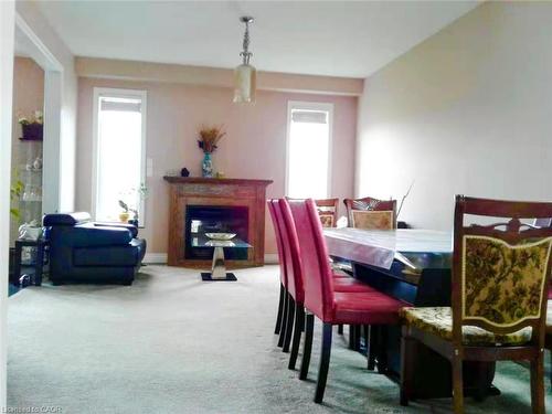 212 Westfield Place, Waterloo, ON - Indoor Photo Showing Dining Room With Fireplace