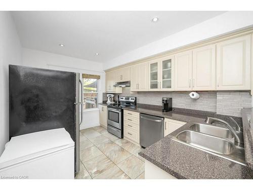 128 Crosthwaite Avenue N, Hamilton, ON - Indoor Photo Showing Kitchen With Double Sink