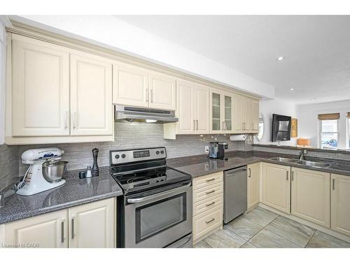 128 Crosthwaite Avenue N, Hamilton, ON - Indoor Photo Showing Kitchen With Double Sink