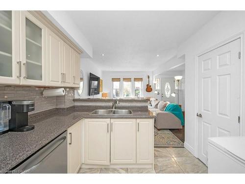 128 Crosthwaite Avenue N, Hamilton, ON - Indoor Photo Showing Kitchen With Double Sink