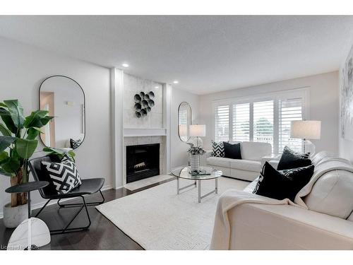 4-1509 Upper Middle Road, Burlington, ON - Indoor Photo Showing Living Room With Fireplace