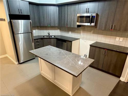 810-560 North Service Road, Grimsby, ON - Indoor Photo Showing Kitchen With Double Sink