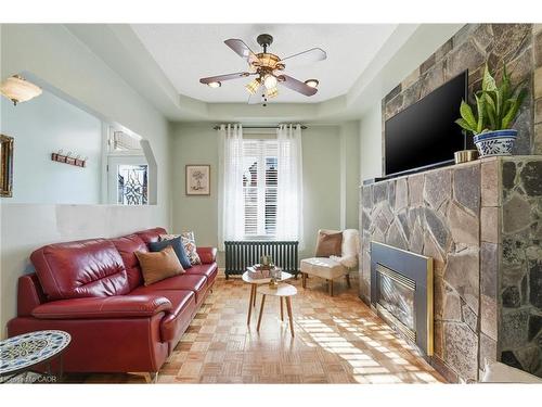 81 Simcoe Street E, Hamilton, ON - Indoor Photo Showing Living Room With Fireplace