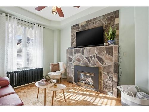 81 Simcoe Street E, Hamilton, ON - Indoor Photo Showing Living Room With Fireplace