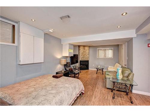 150 Holland Circle, Cambridge, ON - Indoor Photo Showing Bedroom With Fireplace