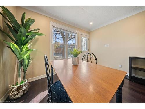 23 Wexford Avenue N, Hamilton, ON - Indoor Photo Showing Dining Room With Fireplace