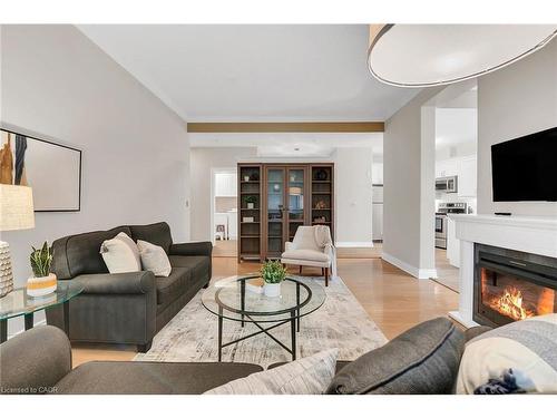 105-1770 Main Street W, Hamilton, ON - Indoor Photo Showing Living Room With Fireplace