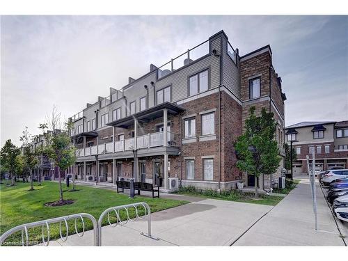 E7-70 Willowrun Drive, Kitchener, ON - Outdoor With Balcony With Facade