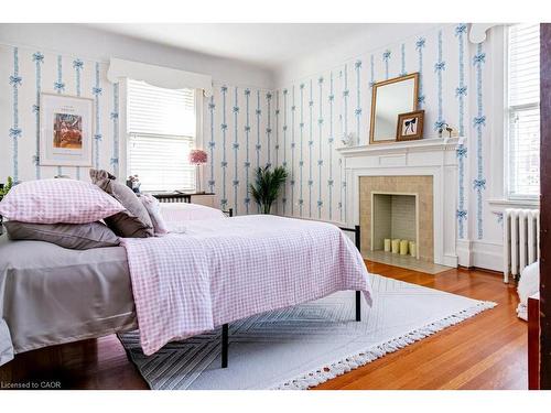 3 Turner Avenue, Hamilton, ON - Indoor Photo Showing Bedroom With Fireplace