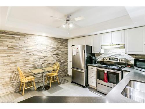 403-5080 Pinedale Avenue, Burlington, ON - Indoor Photo Showing Kitchen With Double Sink
