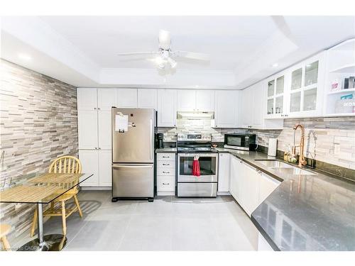 403-5080 Pinedale Avenue, Burlington, ON - Indoor Photo Showing Kitchen With Double Sink